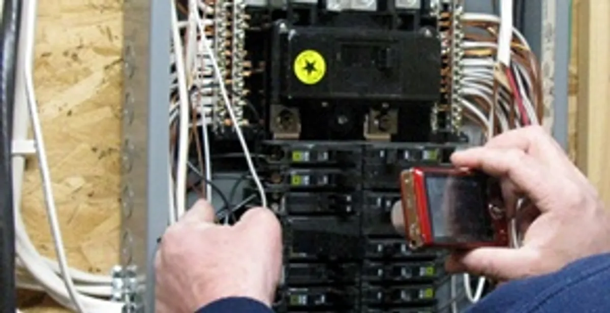Home electrical inspection of circuit breaker panel by licensed electrician in Aurora, CO