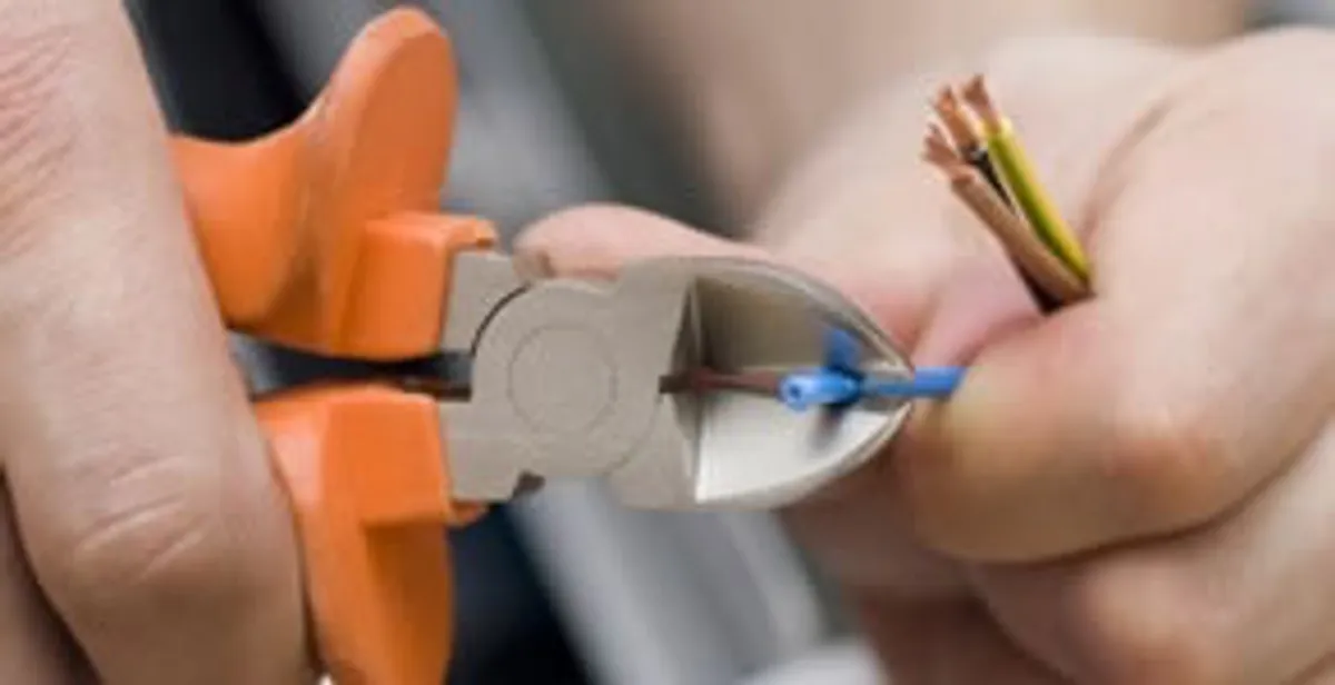 professional electrical services showing precise wire cutting by licensed electricians in Aurora, CO