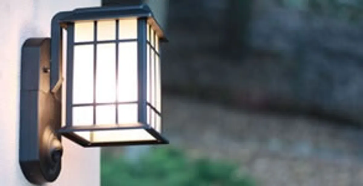 security light installation services with professionally mounted exterior wall light in Aurora, CO