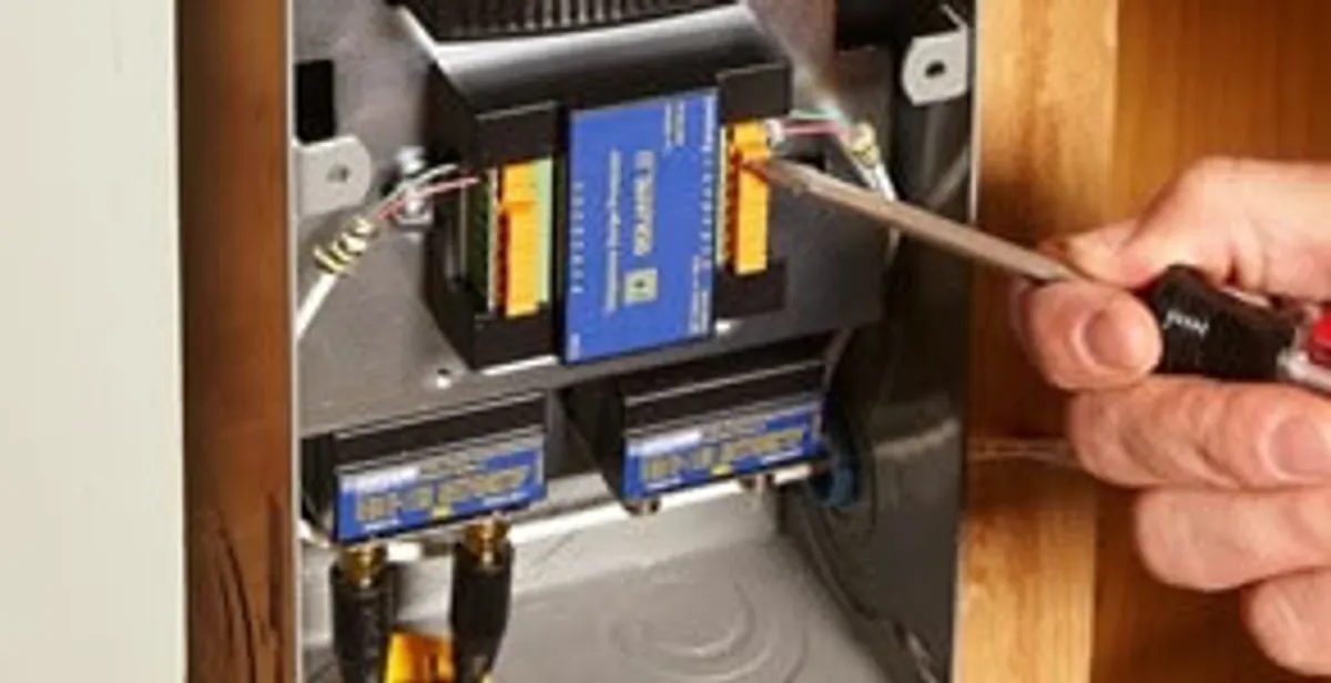 Whole home surge protection device being installed by a licensed electrician to protect electrical systems in Aurora, CO